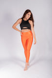 Legging brillante efecto cuero control abdomen color naranja