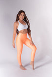 Legging brillante efecto cuero control abdomen color melón neón
