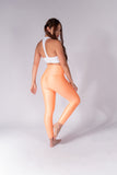 Legging brillante efecto cuero control abdomen color melón neón